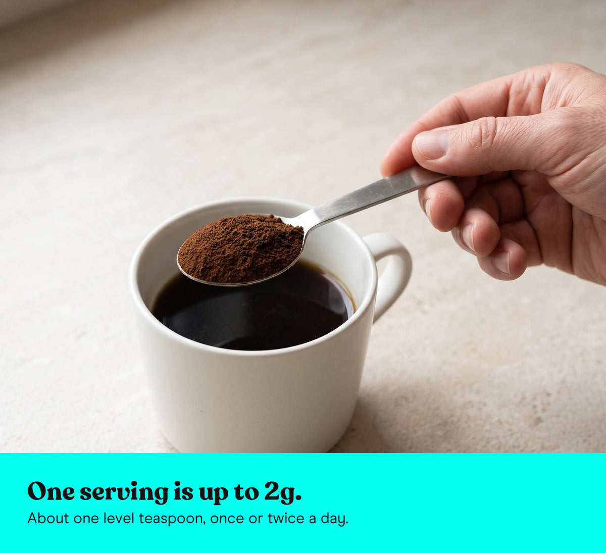 A level teaspoon of Chaga extract powder held over a cup of coffee: one serving is up to 2g, once or twice a day